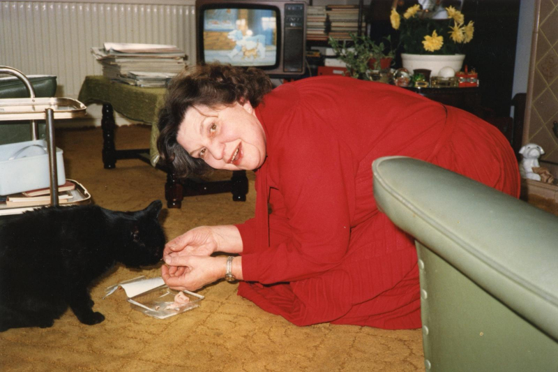 Beryl feeding a black cat