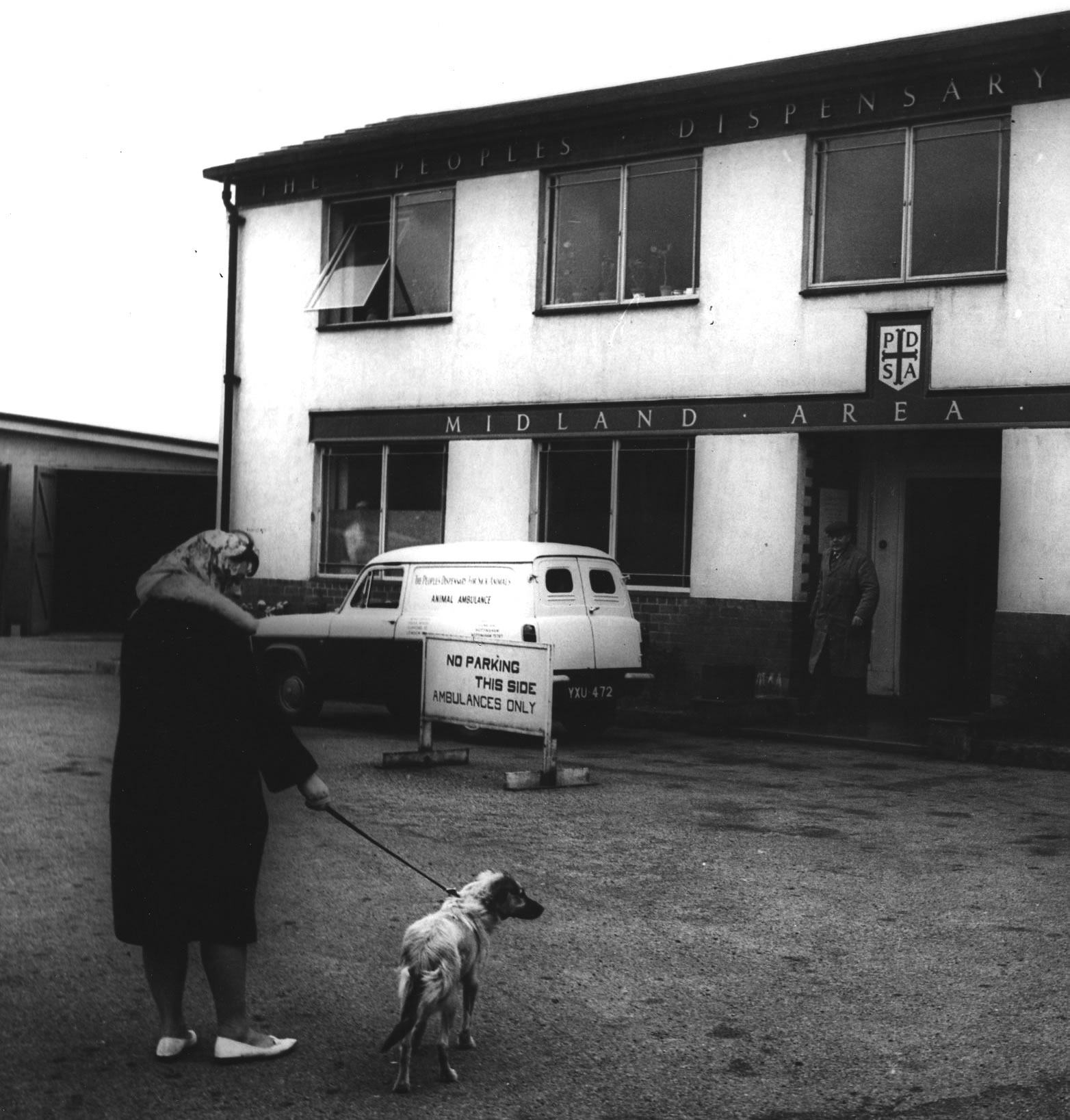 A woman and her dog outside a PDSA Pet Hospital 